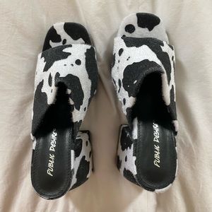 Public Desire Wide Fit Oreo mules in cow print